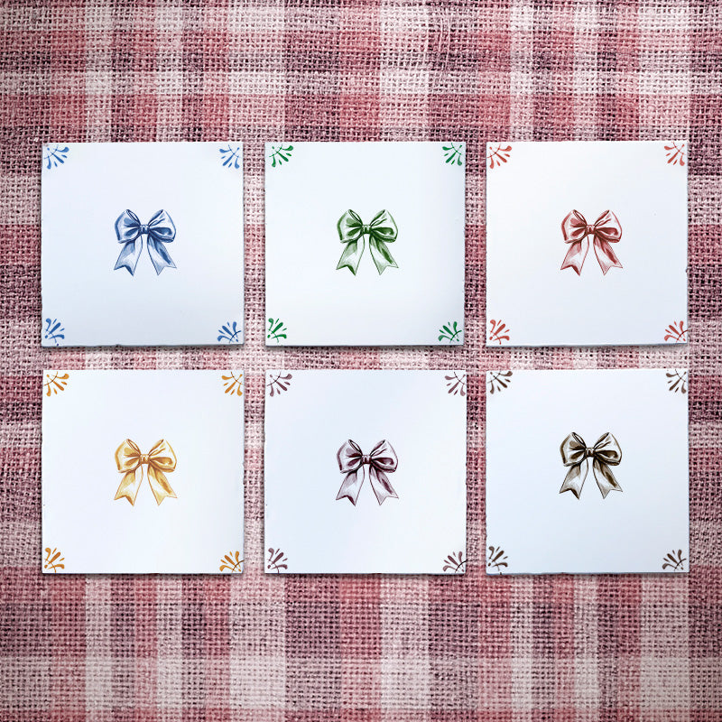 Set of white tiles with bow illustration in blue, green, crimson, mustard, manganese, sepia