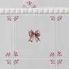 Decorative tiles with a bow and floral patterns on a white background