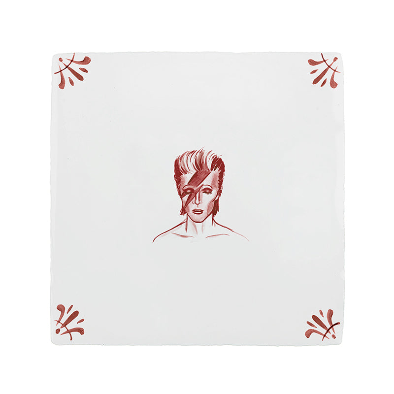 White tile with a crimson patten and illustration of David Bowie