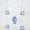 Decorative blue and white chinese vase tile on a tiled wall