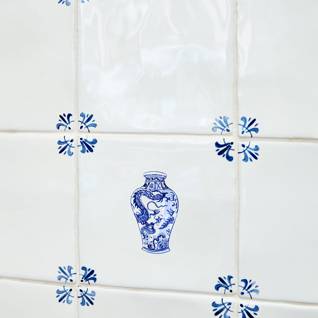 Decorative blue and white chinese vase tile on a tiled wall
