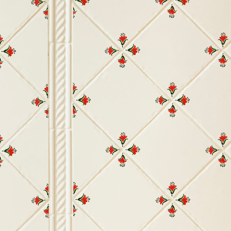 Decorative wall tile with floral pattern on a white background