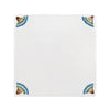 White tile with decorative floral corner designs on a white background