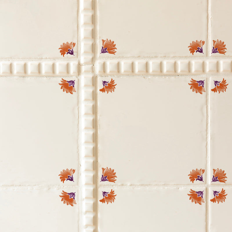 Decorative tiles with floral patterns on a white background