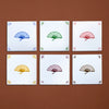 Six tiles with colorful fan designs on a brown background