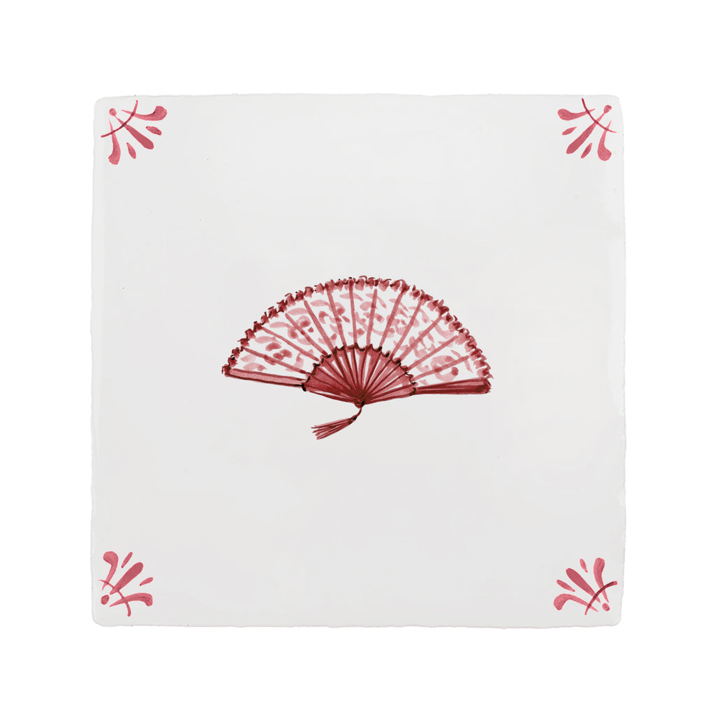 White tile with red decorative fan and decorative corners on a white background