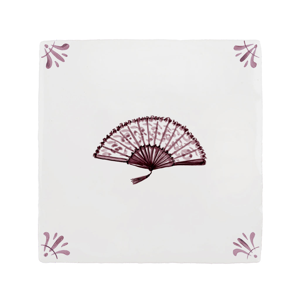 Decorative tile with a fan design on a white background