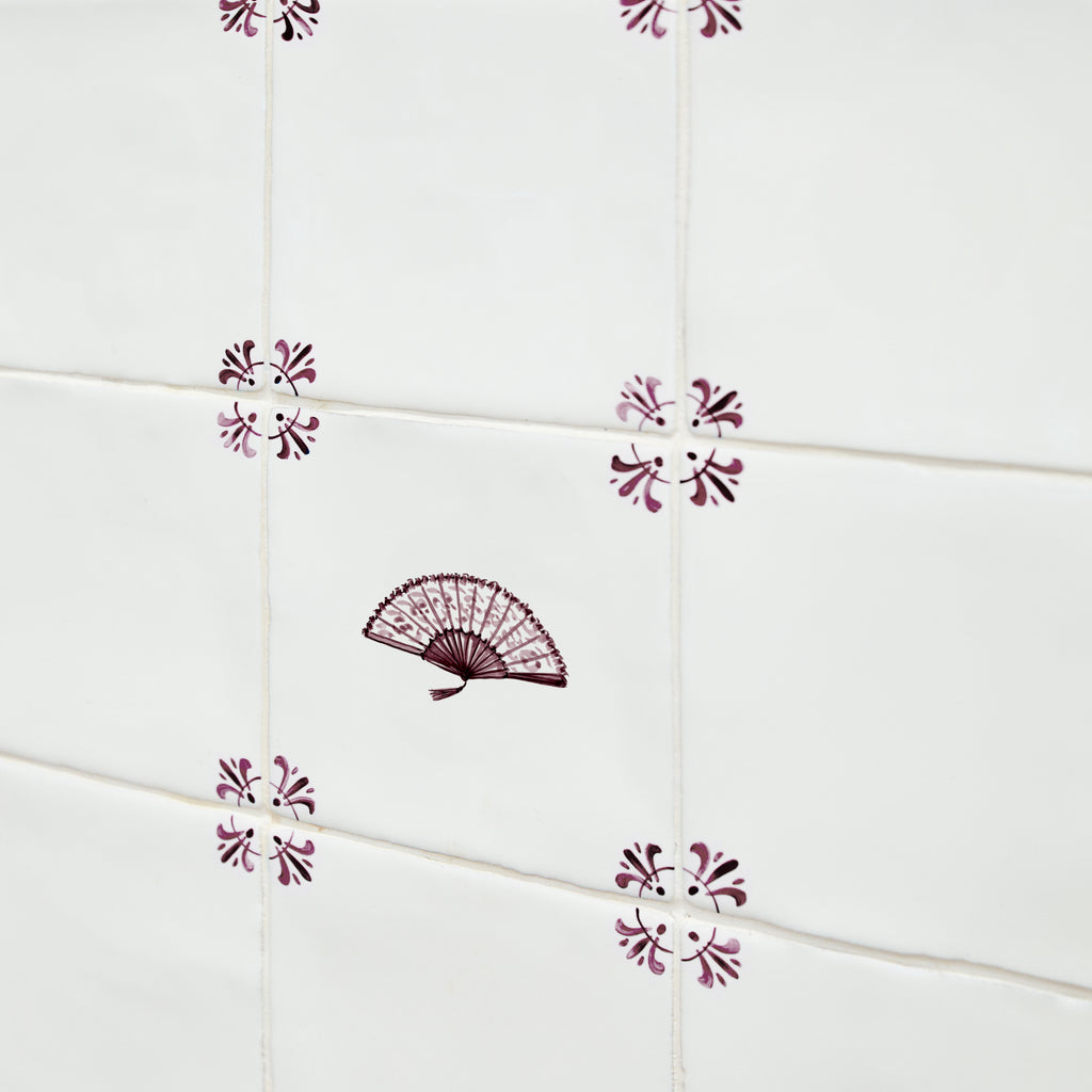 Decorative tiles with a fan design on a white background