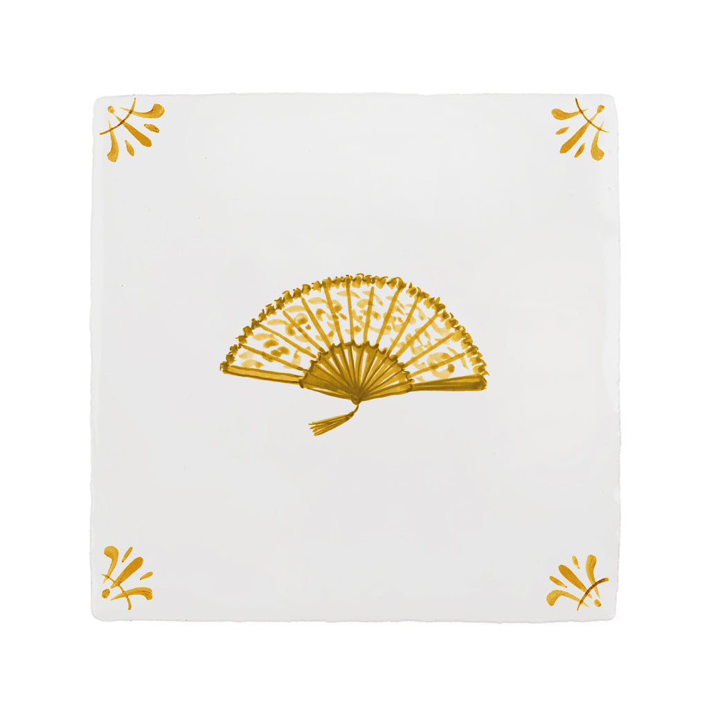 White tile with mustard fan design on a white background