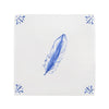 White tile with blue feather design on a white background
