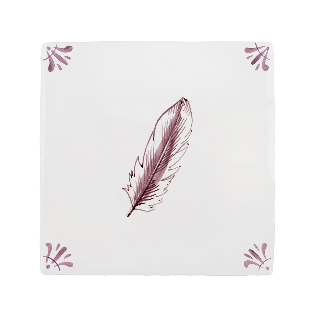 White tile with a feather design on a white background