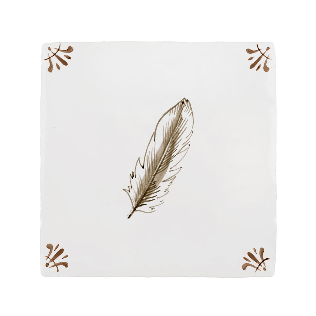 White tile with brown feather design on a white background