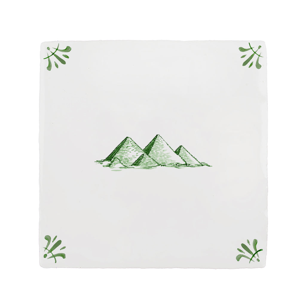 White tile with green pyramid design on a white background