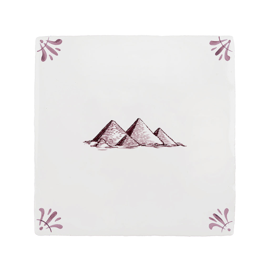 White tile with pyramid design and decorative corners on a white background