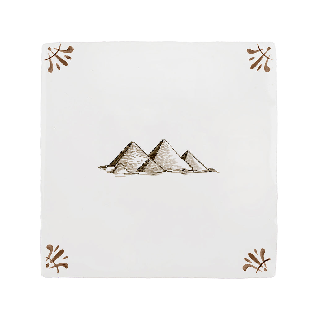 White tile with pyramid design and decorative elements on a white background