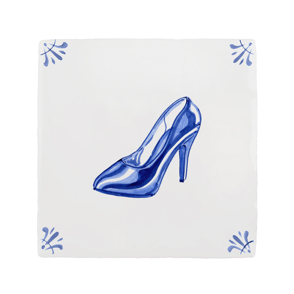 Blue high-heeled shoe on a white tile background with blue decorative corner patterns