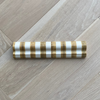 Striped dado tile trim on a wooden floor