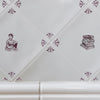 White tiles with decorative manganese patterns and book illustrations