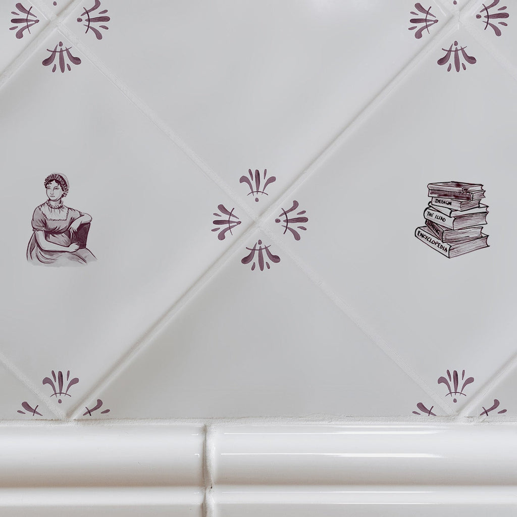 White tiles with decorative manganese patterns and book illustrations