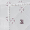 White tiles with red floral patterns on a white background