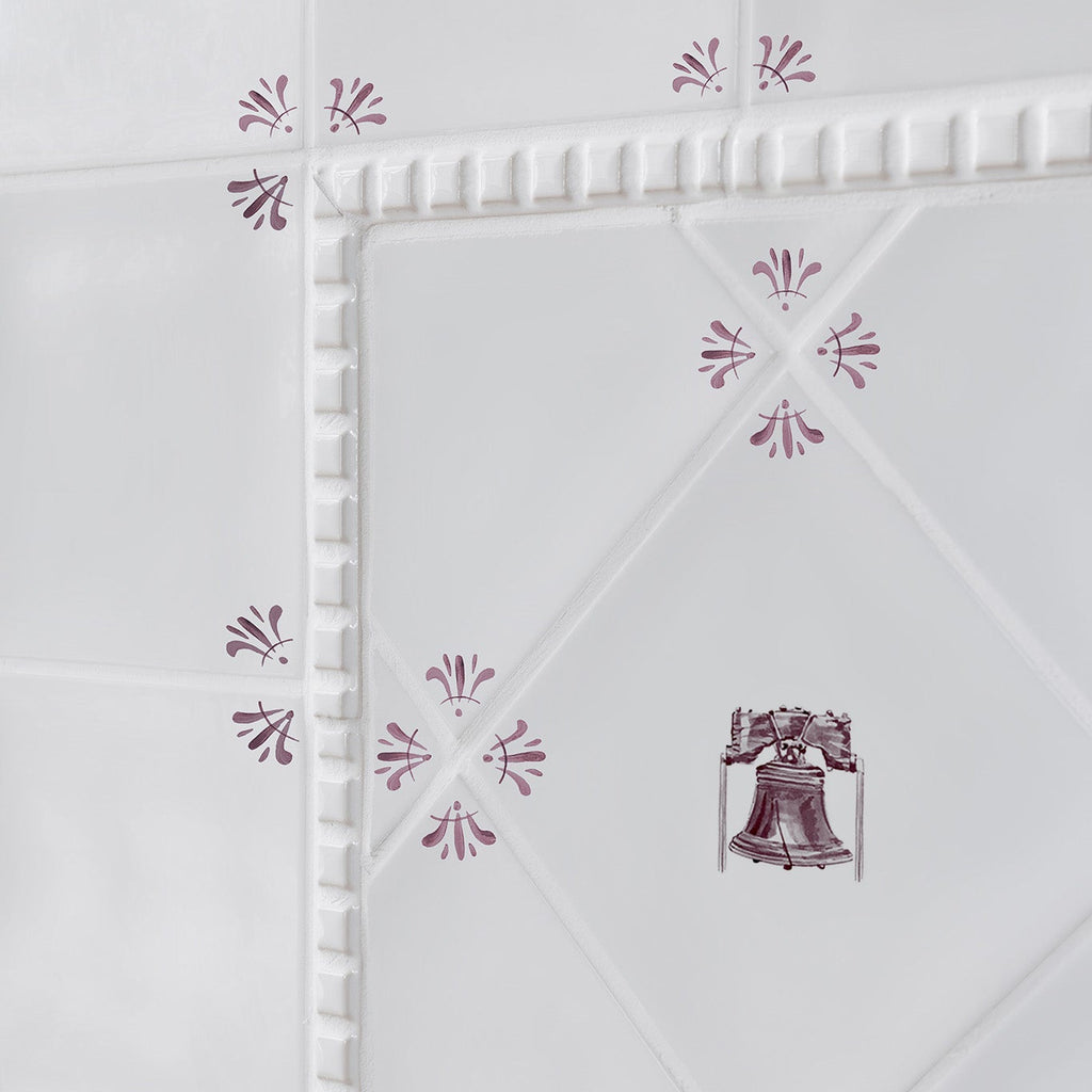 White tiles with red floral patterns on a white background