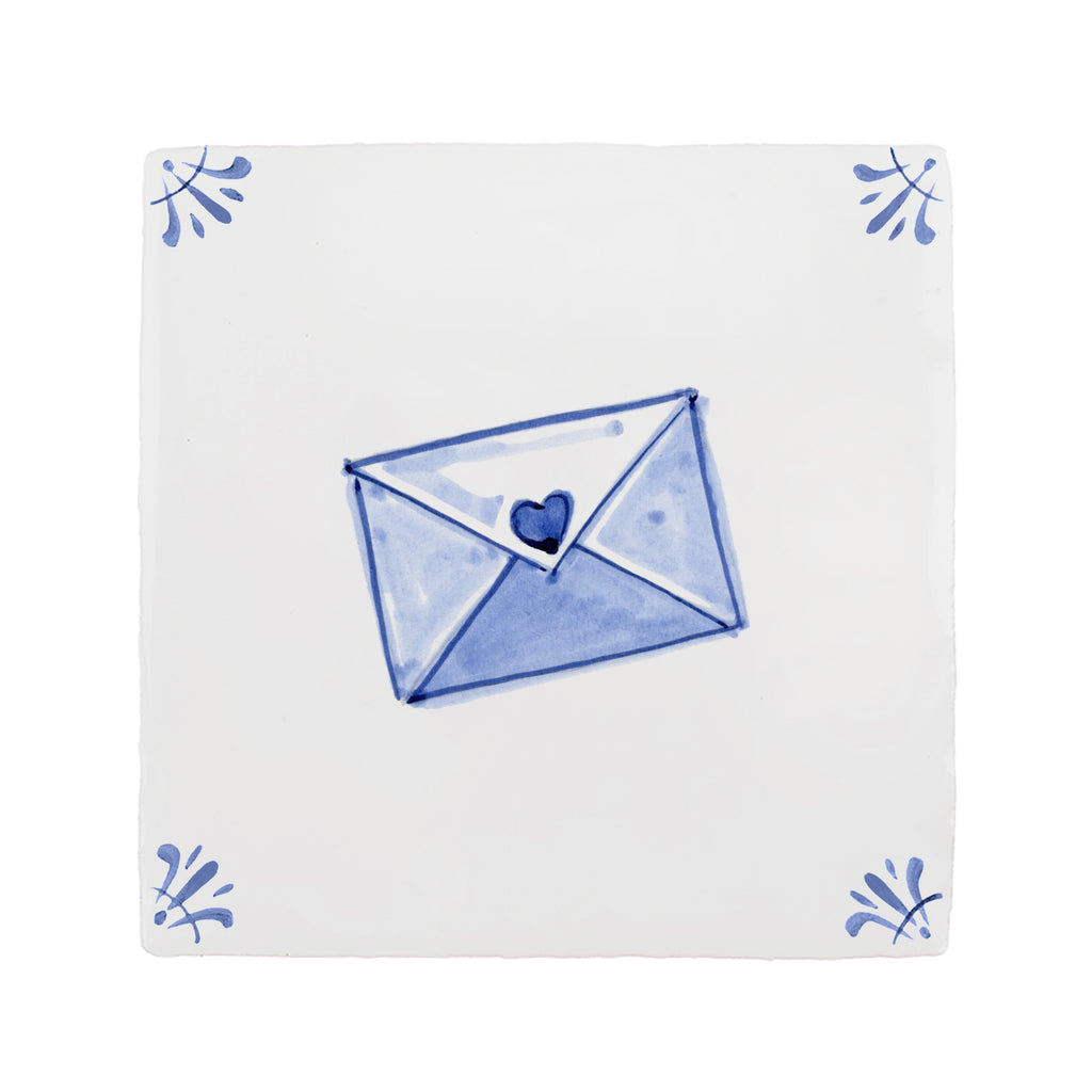 White tile with blue envelope design featuring a heart, on a white background.