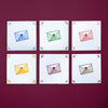 Six colorful envelopes with heart designs on a purple background