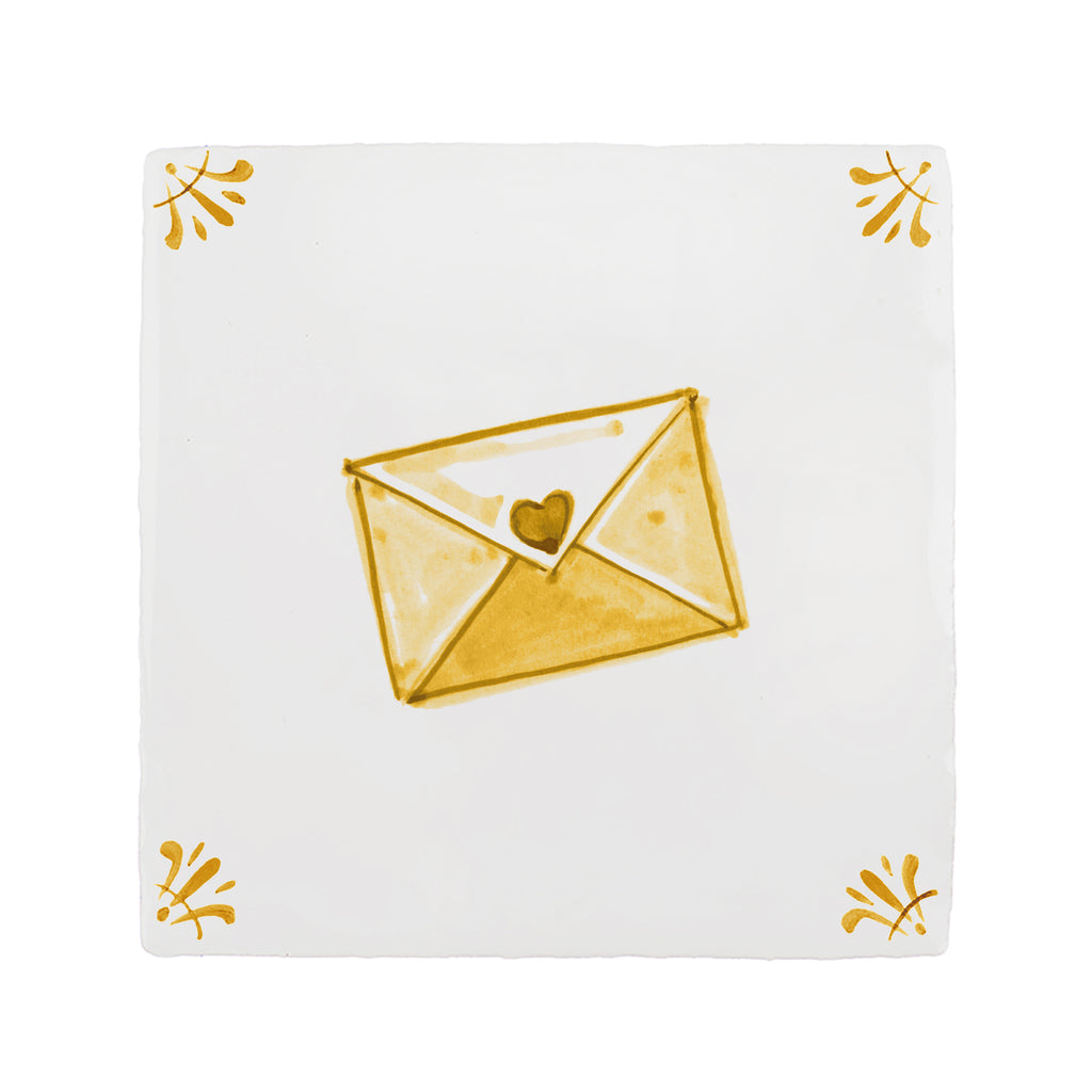 White tile with a mustard yellow envelope and heart design on a white background