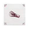 Purple matcha whisk on a white tile background with decorative patterns