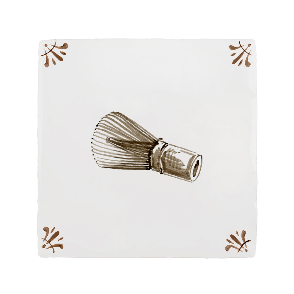 Matcha whisk illustration on a white tile with decorative patterns