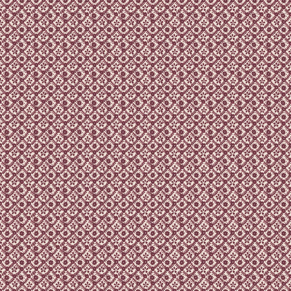 A close-up of a repeating fabric or wallpaper pattern featuring small white floral motifs on a dusty rose or mauve background.