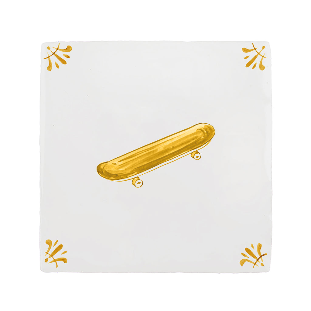 White tile with a mustard design of a skateboard on a white background
