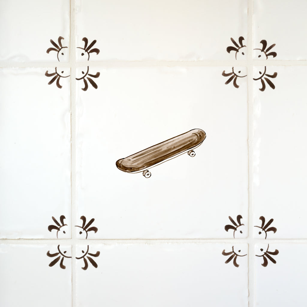 Skateboard design on a tiled wall with decorative elements