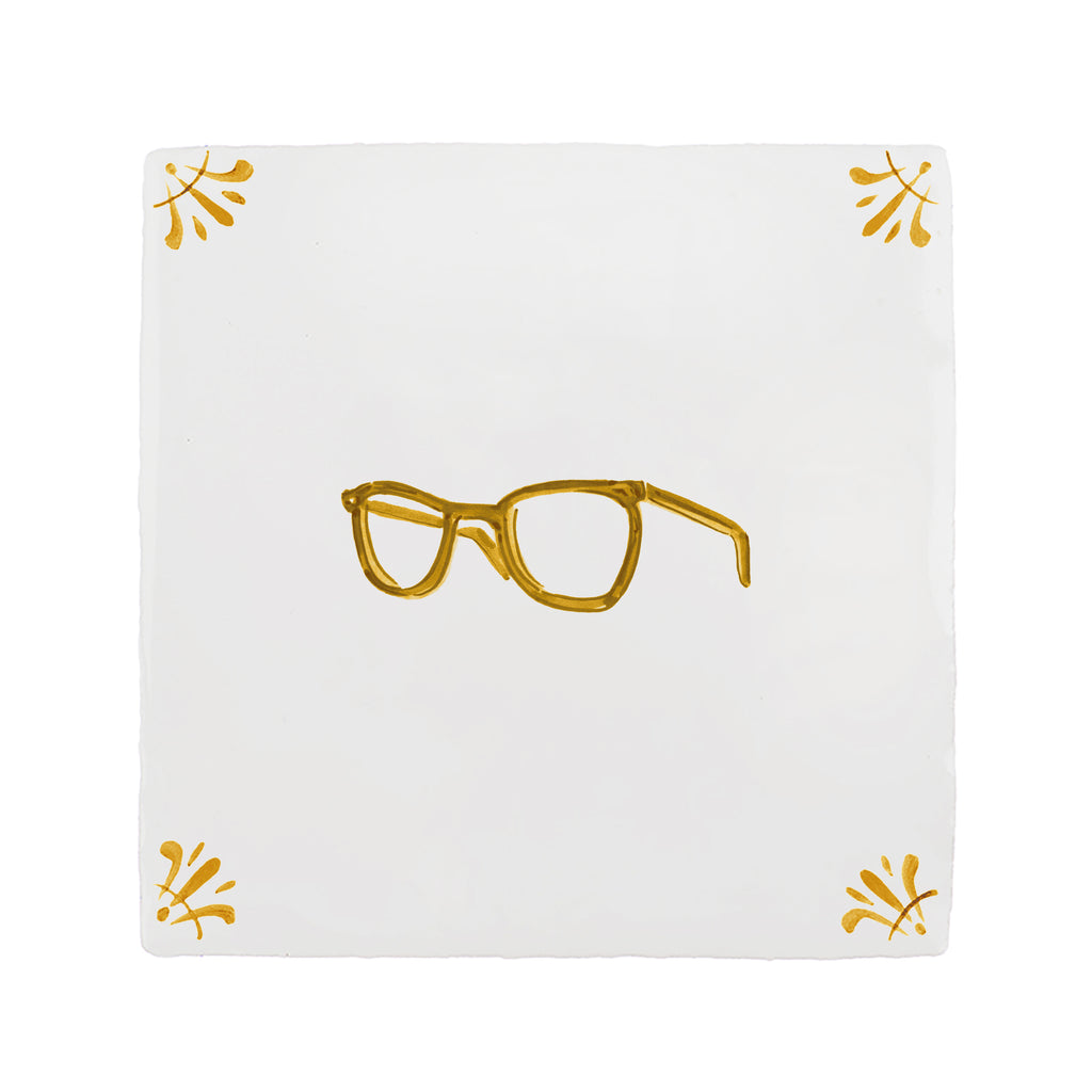 White tile with a mustard design and yellow decorative corner patterns on a white background