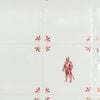 Decorative tiles with a red suit of armour design on a white background