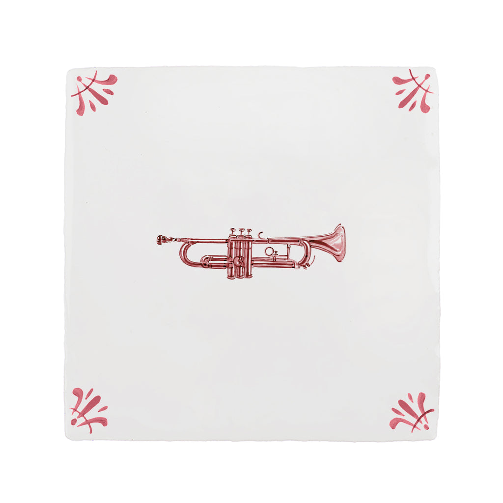 White tile with red trumpet design and decorative corners on a white background