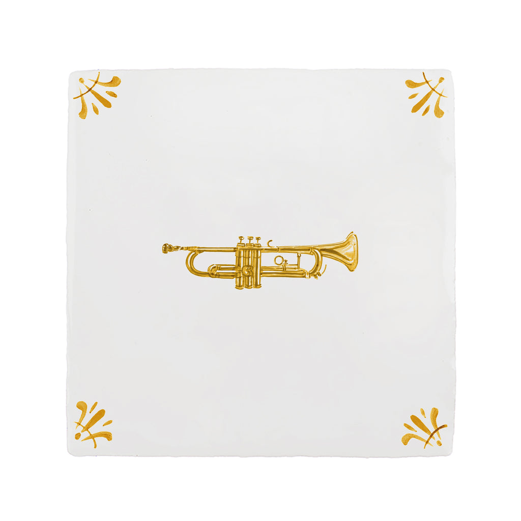White tile with mustard trumpet design on a white background