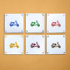 Six square tiles with scooter illustrations in different colors on a beige background
