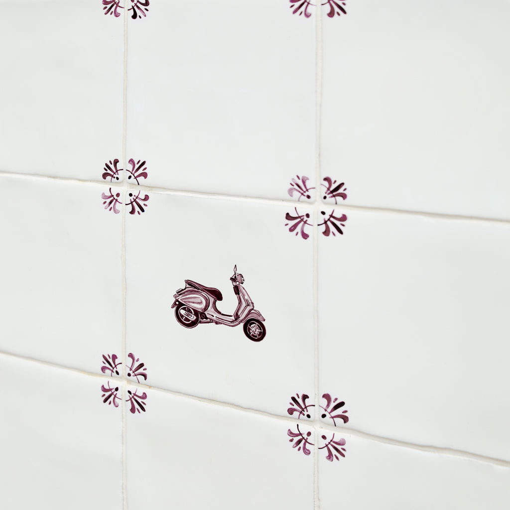 Decorative tiles with a scooter design on a white background