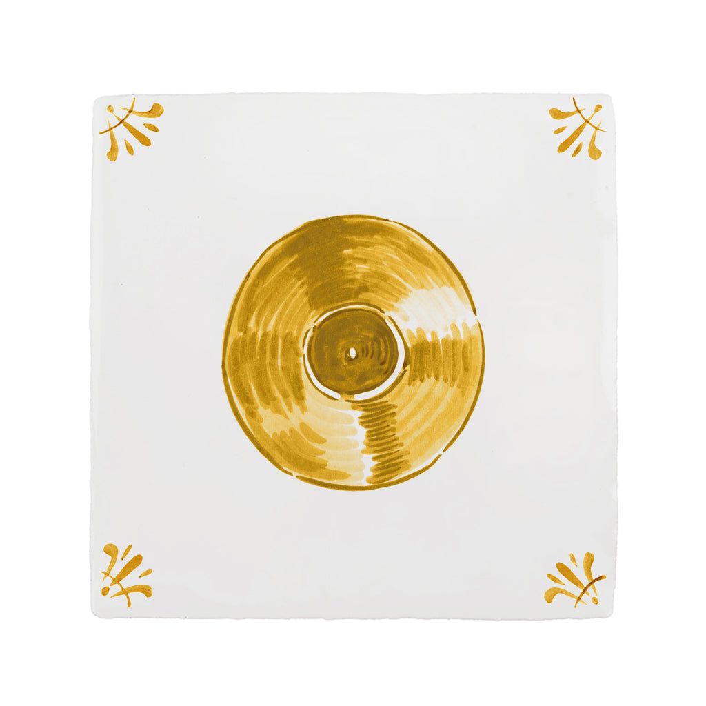 Mustard record on a white tile with decorative elements
